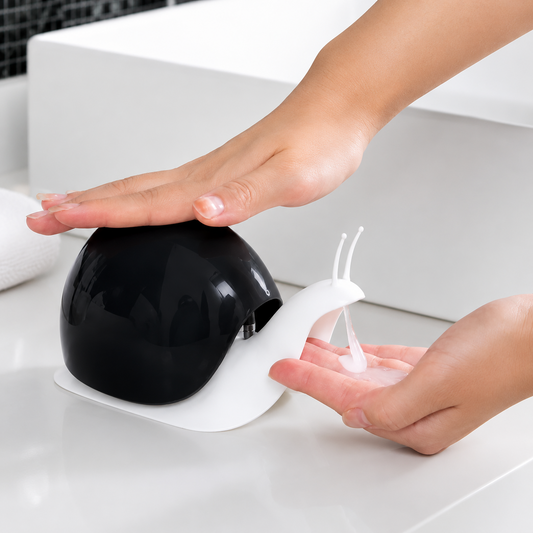 Cartberry black snail shape soap dispenser in use