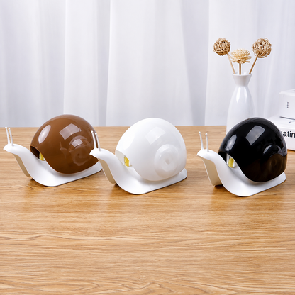 Snail shape liquid dispensers in brown white and black